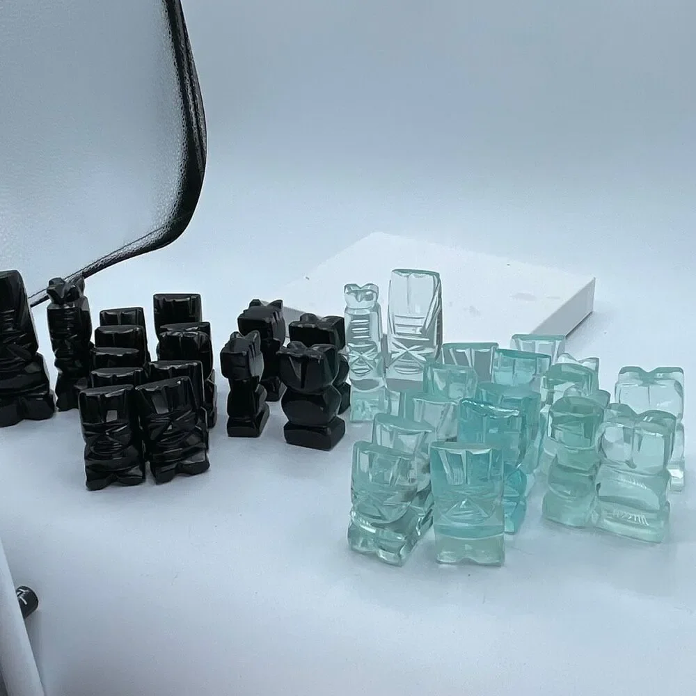 Aztec style chess pieces black obsidian green glass or onyx.